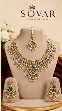 SOVAR bridal necklace, earrings and maang tikka on cream stands beneath the words SOVAR Affordable Luxury.